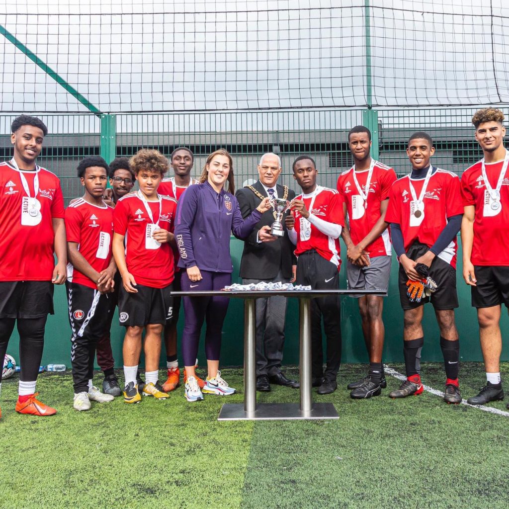 Connect Stars Football group receiving a trophy